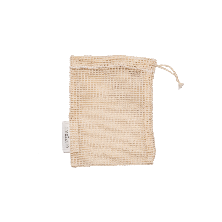 A beige coloured mesh cotton soap bag about 4"x5" with a drawstring opening, and a visible white tag with the logo Tree2zero.