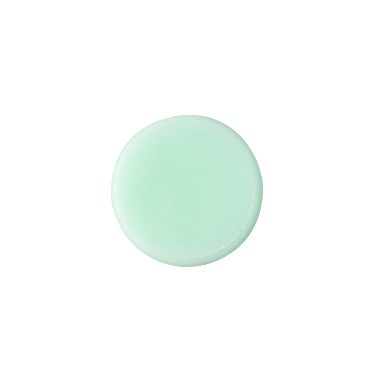 A single bar of Be Bold Conditioner bar that is round and mint green colour.