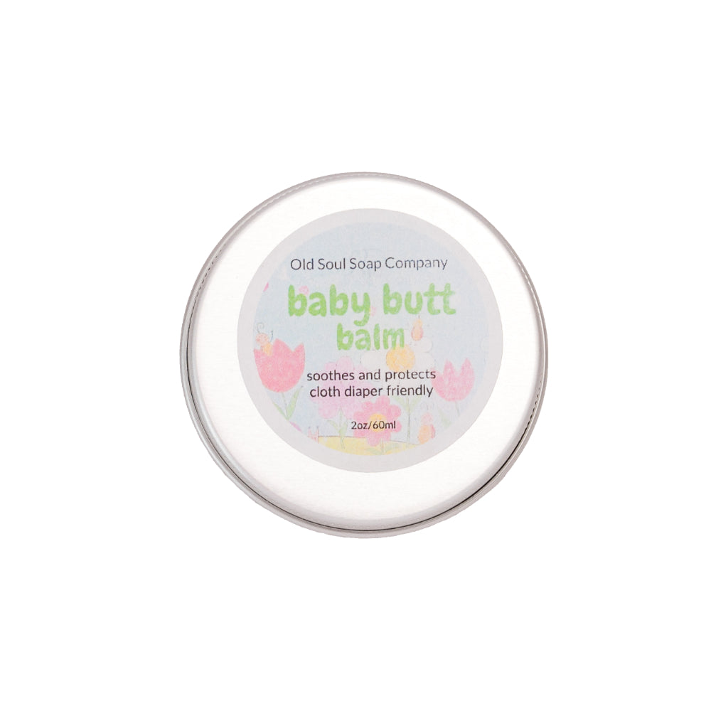 A circular tin container labelled Baby Butt Balm by Old Soul Soap Company.