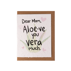 A white greeting card laying over top of a kraft envelope. The card contains an image of a green aloe vera plant, with text "Dear Mom, Aloe-ve you vera much."