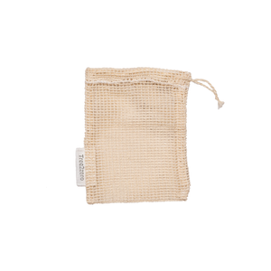 A beige coloured mesh cotton soap bag about 4"x5" with a drawstring opening, and a visible white tag with the logo Tree2zero.
